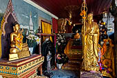 Chiang Mai - Wat Phra That Doi Suthep. The walls of the gallery are covered with Buddha statues and mural paintings of Jataka and tales of the previous lives of the Buddha. 